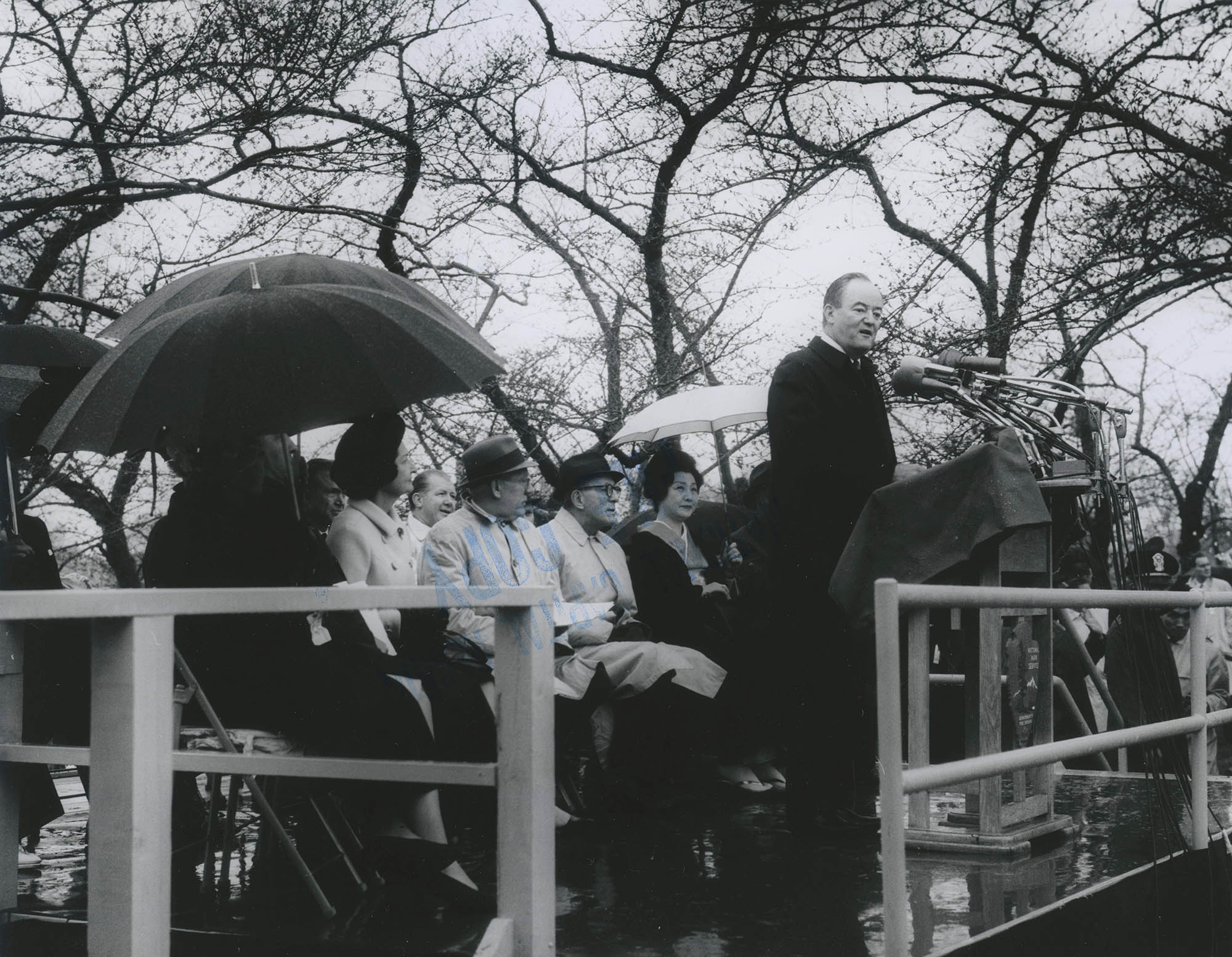 Mr. Takeuchi, ambassador to Japan, is pictured with the stone lantern presented to the USA in 1954